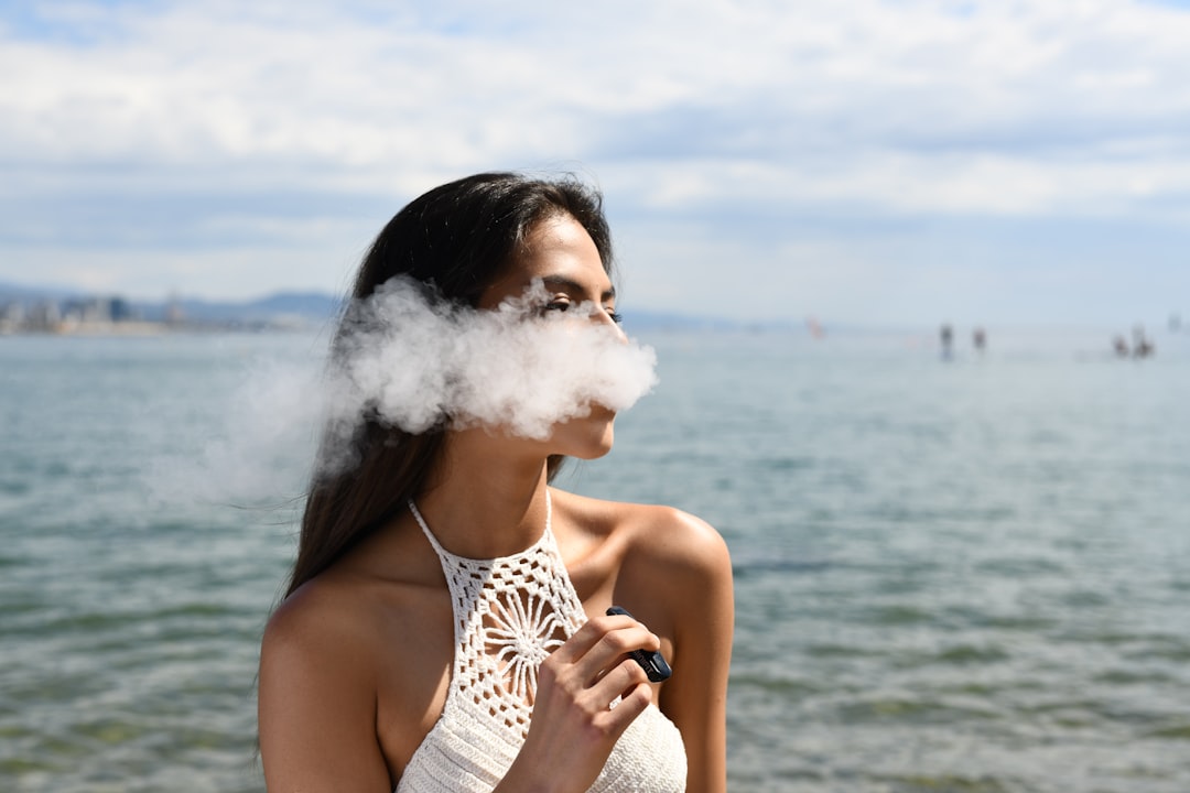 Girl vaping Breathe Organics CBD Liquids #vaping #beach #smoking